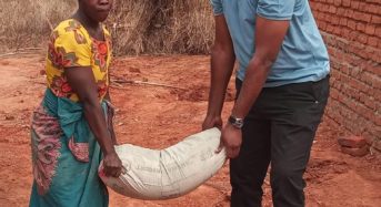 MP Thoko Tembo reaches out to a fire victim in Neno