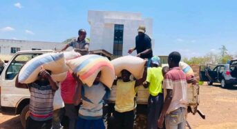 Cha Cha distributes maize to car wash attendants